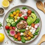 Fresh and vibrant salad bowl with seasonal vegetables and fruits, showcasing easy salad recipes.